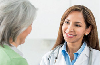 Woman doctor listening to patient
