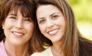 Portrait Hispanic mother and adult daughter.